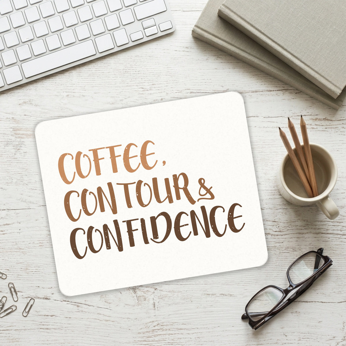 Coffee Contour & Confidence mouse pad on a desk with a keyboard