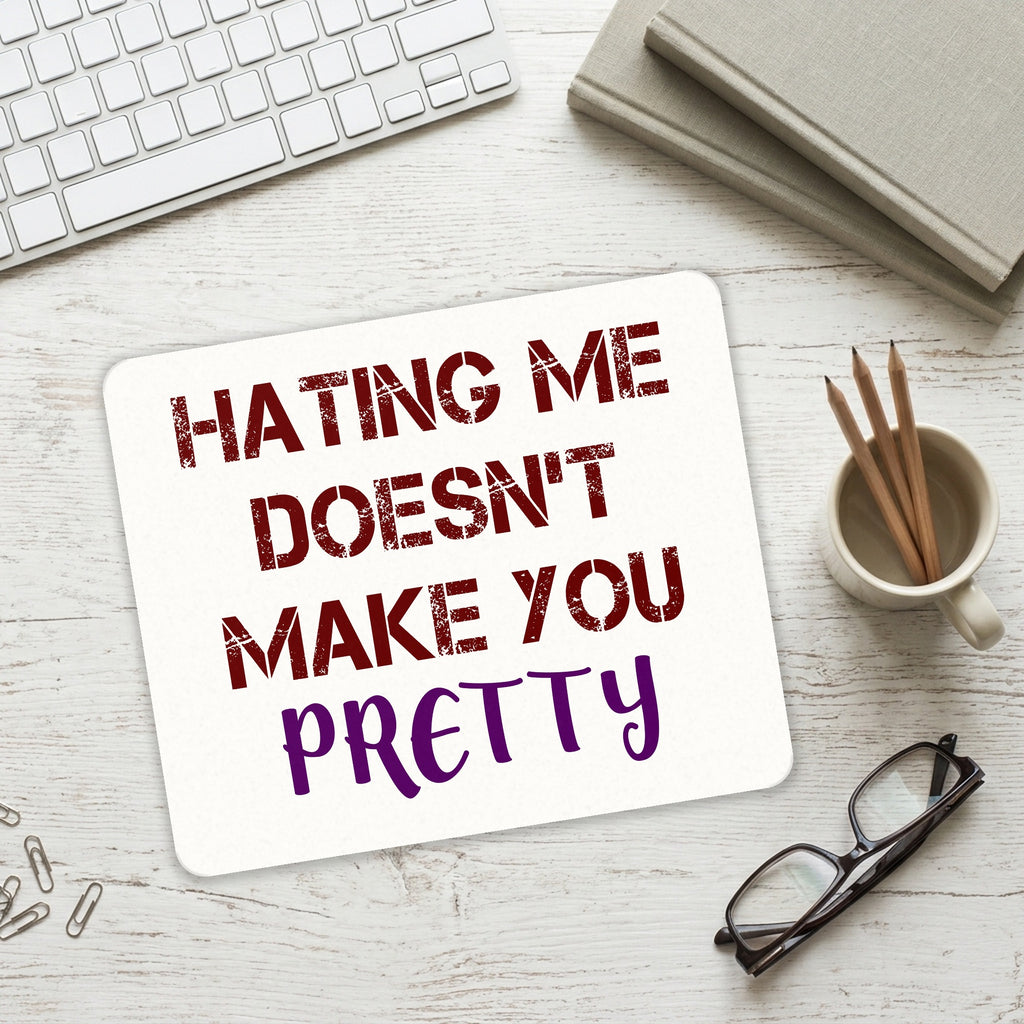 Hating Me Doesn't Make You Pretty mouse pad on a desk with a keyboard