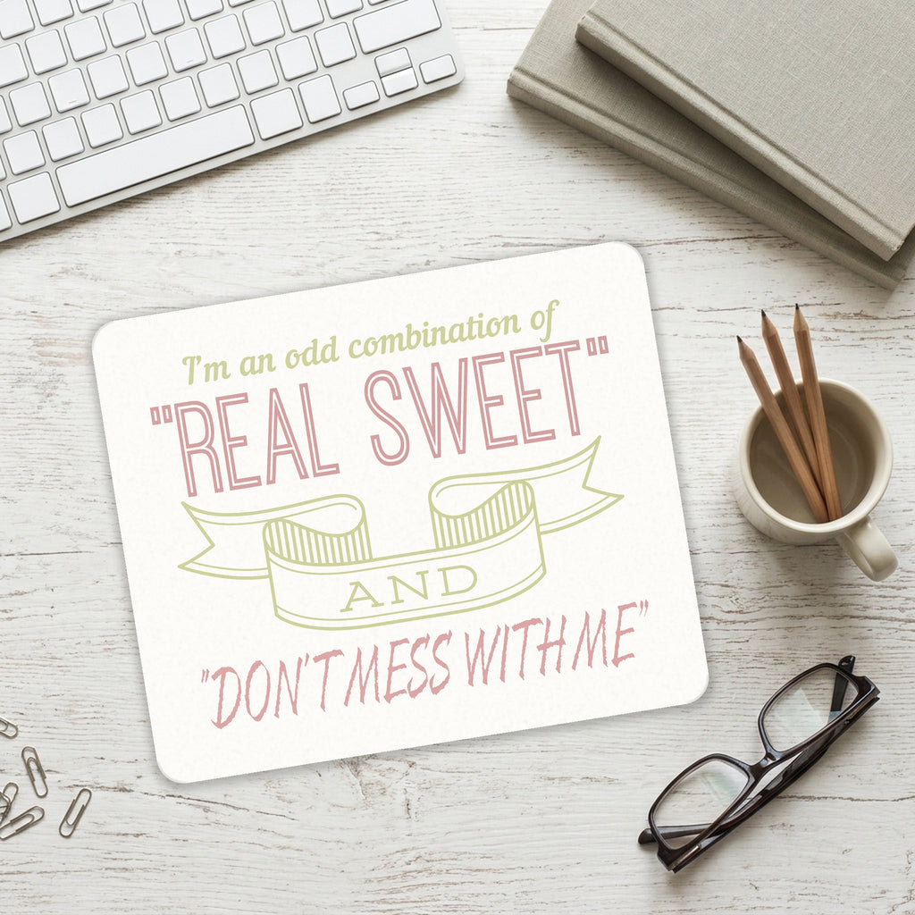 Odd Combination Real Sweet & Don't Mess With Me mouse pad on a desk with a keyboard