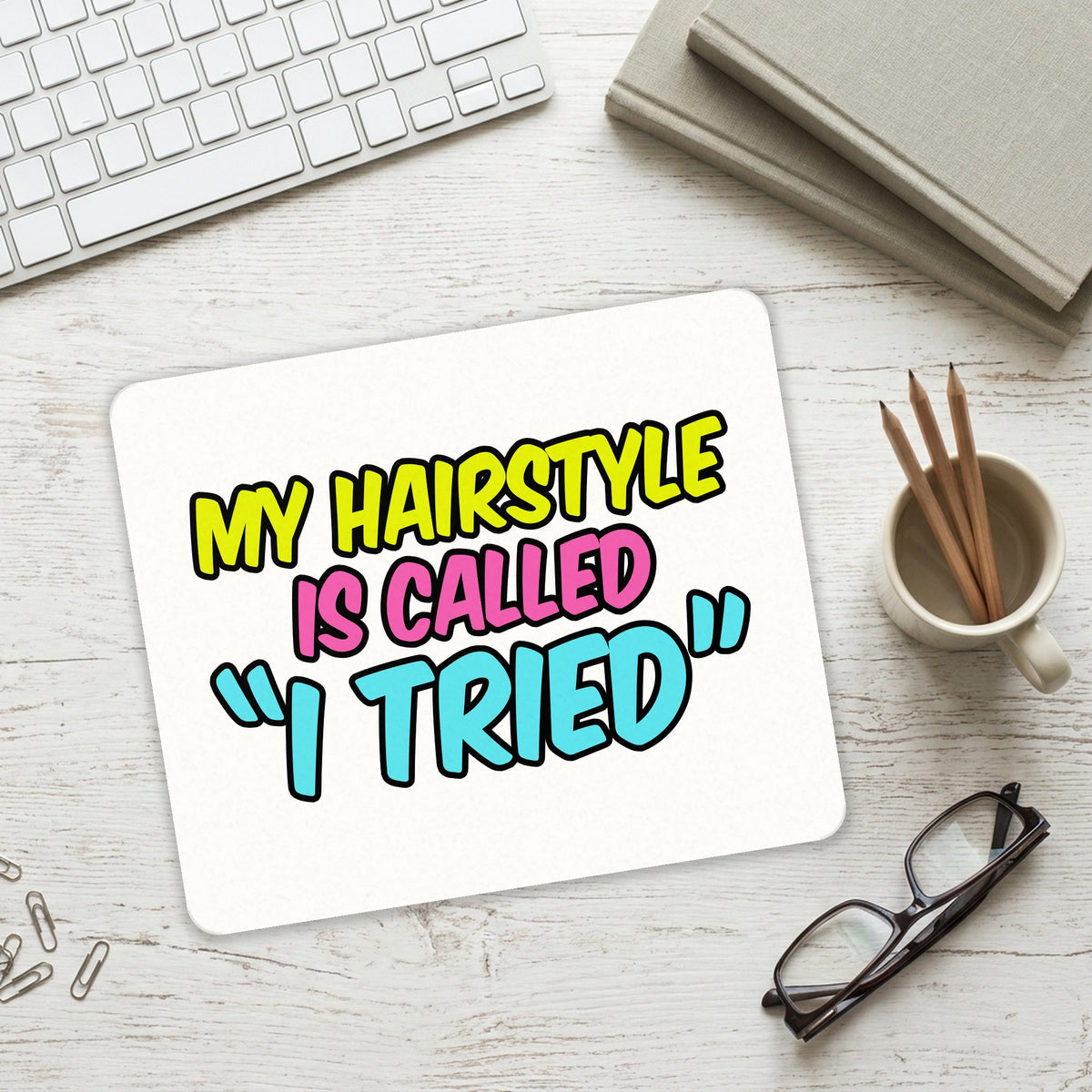My Hairstyle is Called "I Tried" mouse pad on a desk with a keyboard