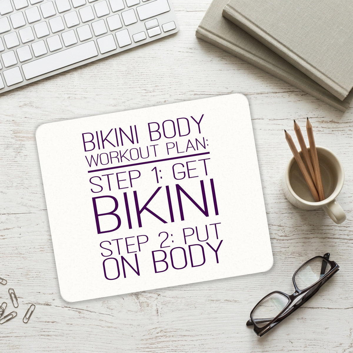 Bikini Body Workout Plan Get Bikini Put On Body mouse pad on a desk with a keyboard