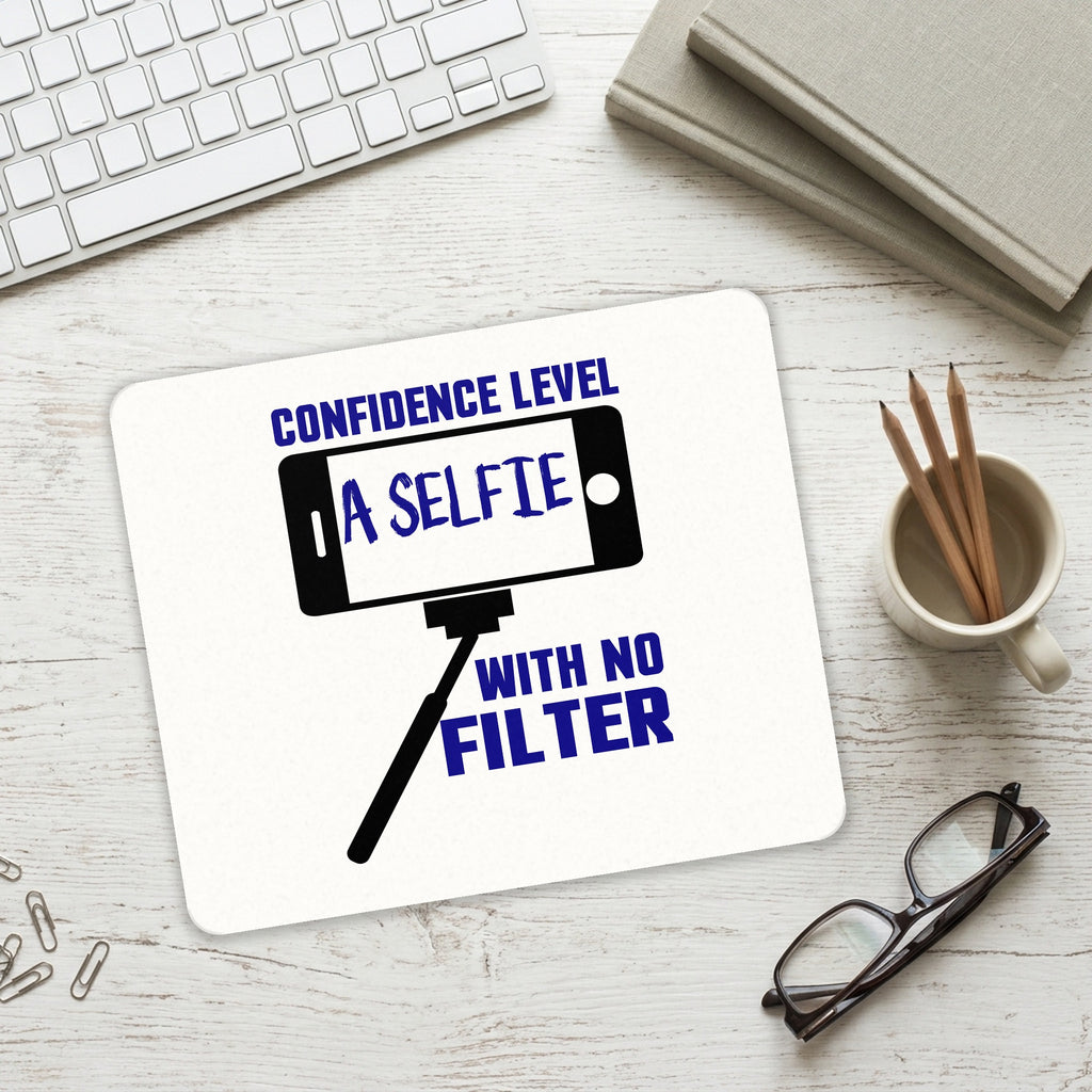 Confidence Level Selfie with No Filter mouse pad on a desk with a keyboard