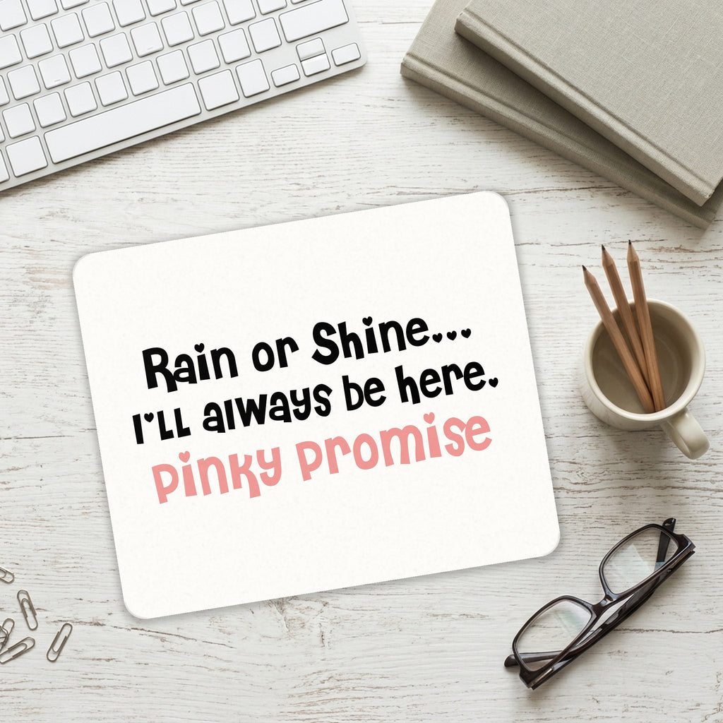 Rain or Shine I'll Always Be Here. Pinky Promise mouse pad on a desk with a keyboard