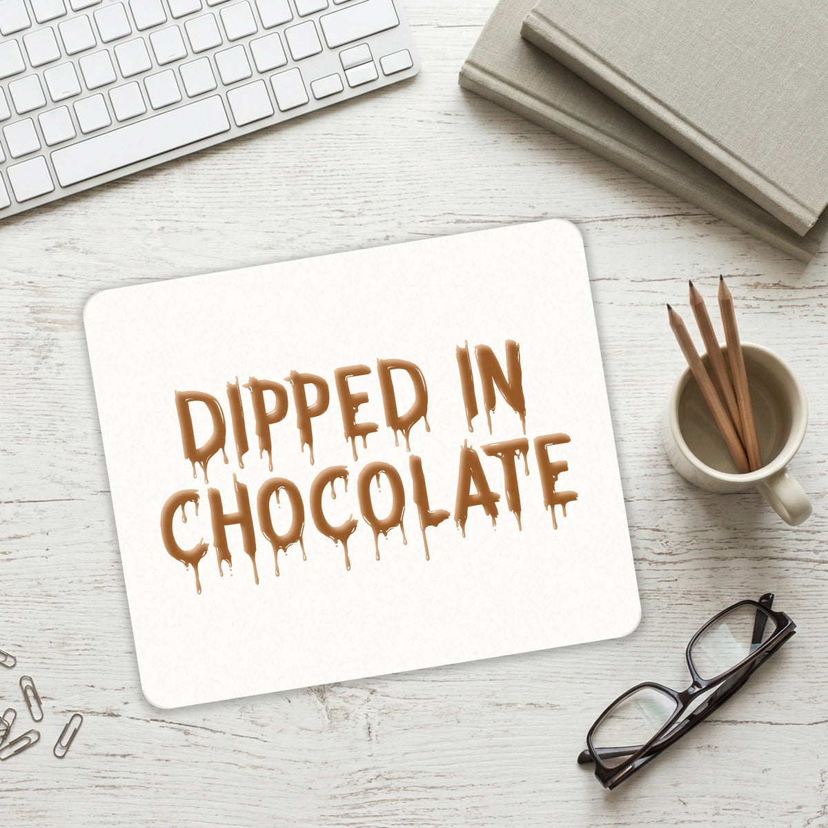 Dipped in Chocolate mouse pad on a desk with a keyboard