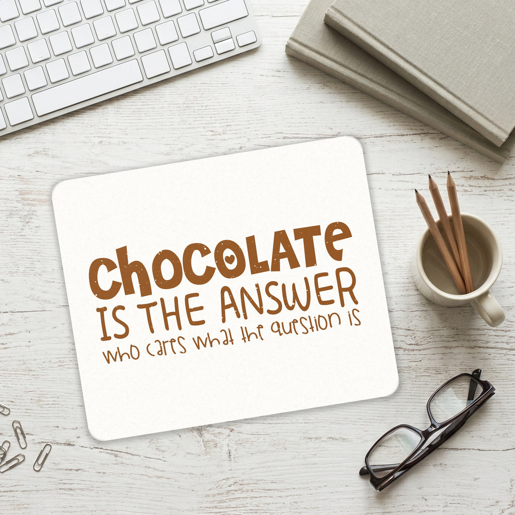 Chocolate is the Answer Who Cares Question mouse pad on a desk with a keyboard