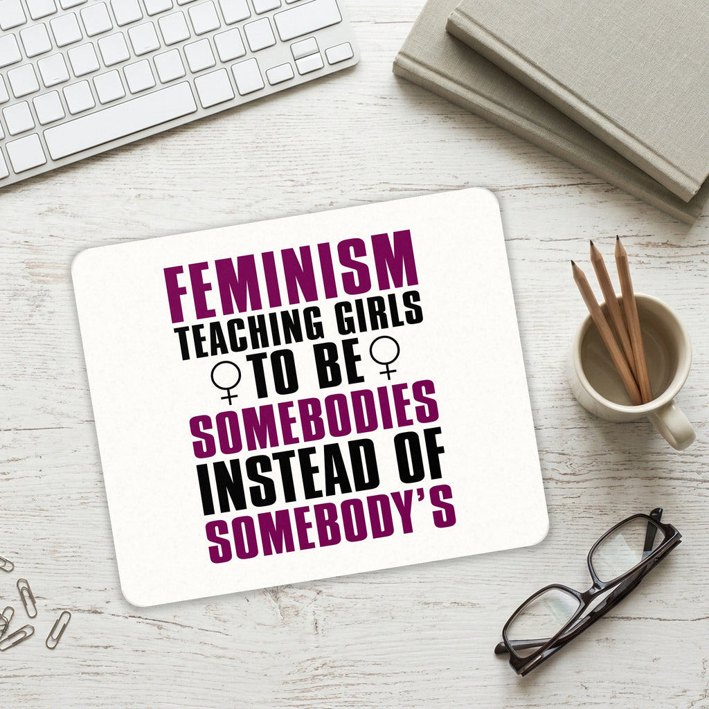 Feminism - Somebodies vs Somebody's mouse pad on a desk with a keyboard