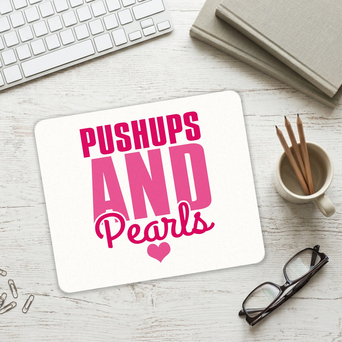 Pushups and Pearls mouse pad on a desk with a keyboard