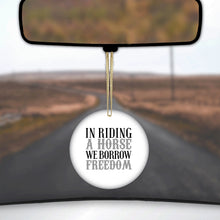 DistinctInk® Hanging Ceramic Christmas Tree Ornament with Gold String - Great Gift / Present - 2 3/4 inch Diameter - In Riding a Horse, We Borrow Freedom