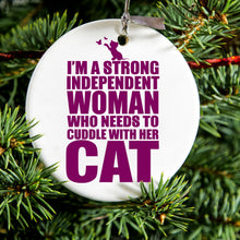 DistinctInk® Hanging Ceramic Christmas Tree Ornament with Gold String - Great Gift / Present - 2 3/4 inch Diameter - Strong Woman Needs to Cuddle Cat