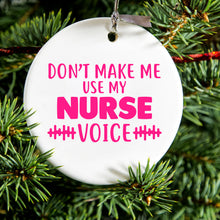 DistinctInk® Hanging Ceramic Christmas Tree Ornament with Gold String - Great Gift / Present - 2 3/4 inch Diameter - Don't Make Me Use My Nurse Voice - Pink