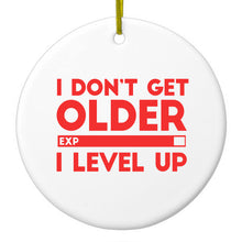 DistinctInk® Hanging Ceramic Christmas Tree Ornament with Gold String - Great Gift / Present - 2 3/4 inch Diameter - I Don't Get Older I Level Up - Gamer
