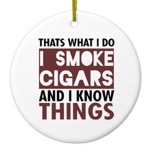 DistinctInk® Hanging Ceramic Christmas Tree Ornament with Gold String - Great Gift / Present - 2 3/4 inch Diameter - I Smoke Cigars And I Know Things