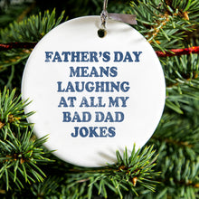 DistinctInk® Hanging Ceramic Christmas Tree Ornament with Gold String - Great Gift / Present - 2 3/4 inch Diameter - Father's Day Means Laughing At Bad Dad Jokes