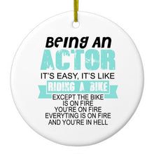 DistinctInk® Hanging Ceramic Christmas Tree Ornament with Gold String - Great Gift / Present - 2 3/4 inch Diameter - Being An Actor is Easy - It's Like Riding A Bike