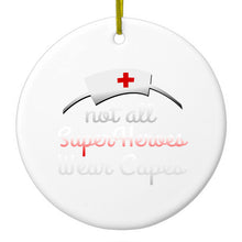 DistinctInk® Hanging Ceramic Christmas Tree Ornament with Gold String - Great Gift / Present - 2 3/4 inch Diameter - Nurse - Not All Super Heroes Wear Capes