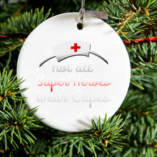DistinctInk® Hanging Ceramic Christmas Tree Ornament with Gold String - Great Gift / Present - 2 3/4 inch Diameter - Nurse - Not All Super Heroes Wear Capes