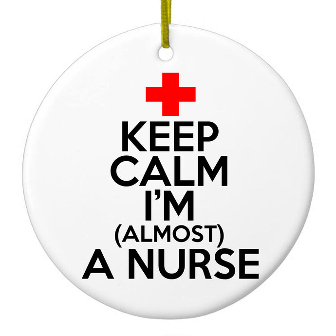 DistinctInk® Hanging Ceramic Christmas Tree Ornament with Gold String - Great Gift / Present - 2 3/4 inch Diameter - Keep Calm I'm Almost a Nurse