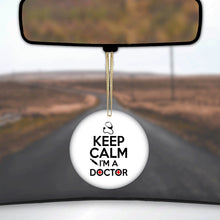 DistinctInk® Hanging Ceramic Christmas Tree Ornament with Gold String - Great Gift / Present - 2 3/4 inch Diameter - Keep Calm I'm A Doctor