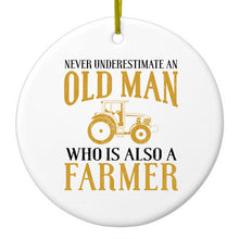 DistinctInk® Hanging Ceramic Christmas Tree Ornament with Gold String - Great Gift / Present - 2 3/4 inch Diameter - Never Underestimate Old Man Farmer