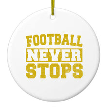 DistinctInk® Hanging Ceramic Christmas Tree Ornament with Gold String - Great Gift / Present - 2 3/4 inch Diameter - Football Never Stops