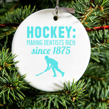 DistinctInk® Hanging Ceramic Christmas Tree Ornament with Gold String - Great Gift / Present - 2 3/4 inch Diameter - Hockey Making Dentists Rich Since 1875