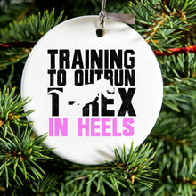 DistinctInk® Hanging Ceramic Christmas Tree Ornament with Gold String - Great Gift / Present - 2 3/4 inch Diameter - Training to Outrun T-Rex in Heels